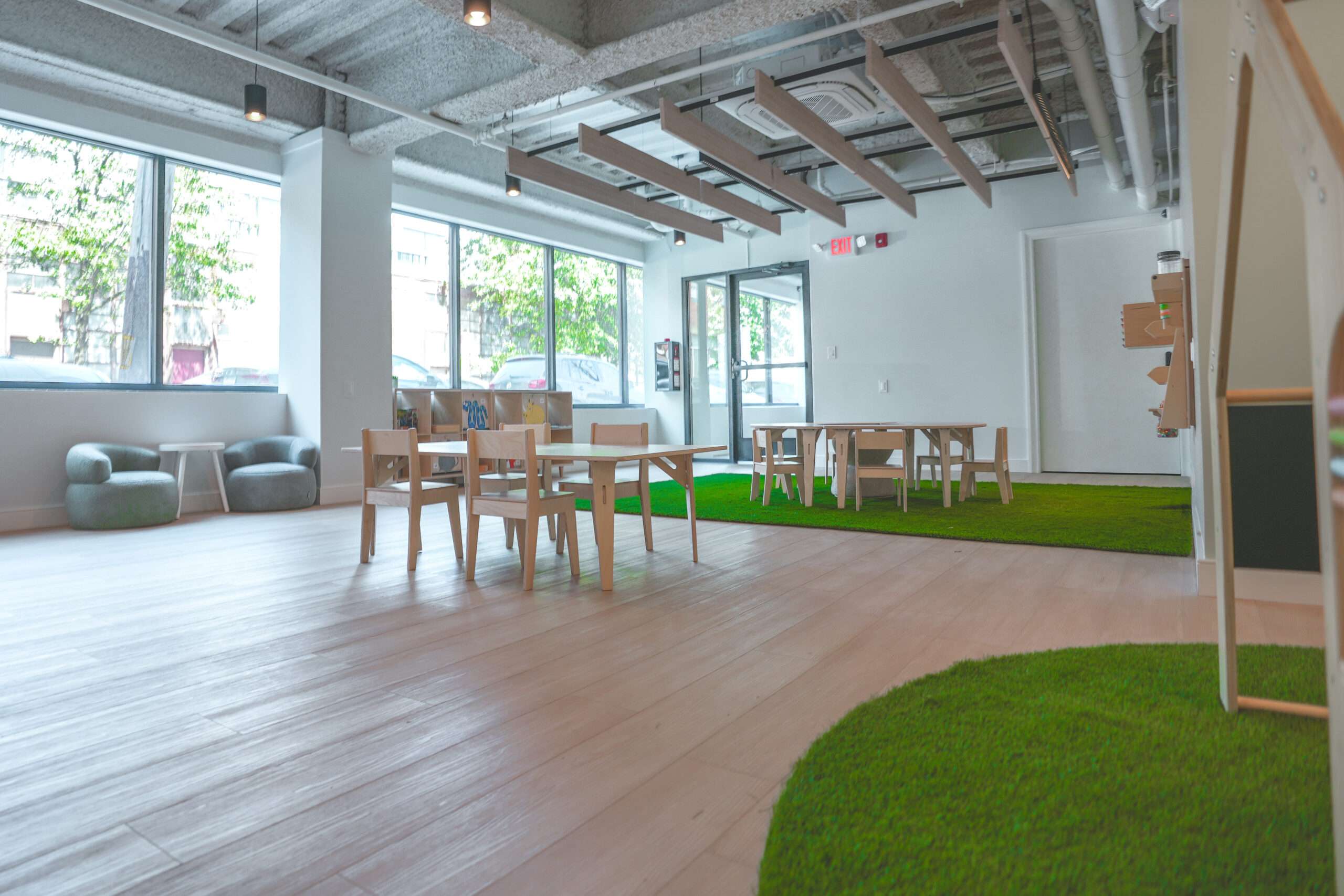 Classroom at Recess with low open shelving, natural materials and soft daylight